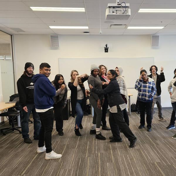 A group of students in a space making faces and in interesting poses. 